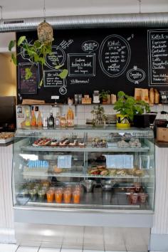 Chez Madame | Malmö, Sweden  I love the fun blackboard and clean display case.