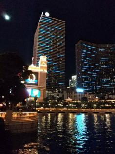 The waters of The Bellagio reflect the blue lights of The Cosmopolitan Hotel, Las Vegas