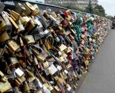 The lock bridge- Paris, France Couples from all over France go to this bridge and they put a lock on the bridge and throw the key into the river.