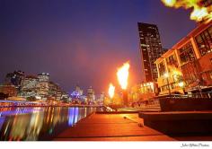 Gas powered flames on the edge of the Yarra River. South Bank. Melbourne. Victoria. Australia