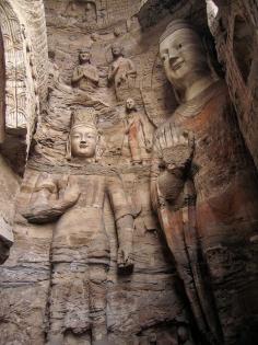 Stone carved Buddhas at Yungang Grottoes in Datong, China (by Around the World in 480 Days).