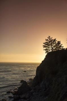 Plan your next road trip down California's Highway 1- one of America's most iconic drives where you can see beautiful views, like this sunset in Big Sur.