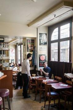 Lunchtime at Café des Musées and the head waiter takes an order