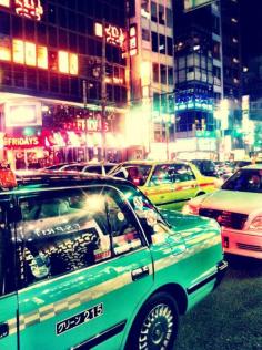 Tokyo Taxis jockey to whisk their tired passengers home for a short but hopefully fitful sleep