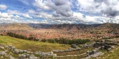 A partial view of the ruins of the Incan fortress, Sacsahuaman in the foreground with the former Incan capital of Cusco in the valley below. Most of the stones that were once here as buildings were used to build many of the Spanish colonial structures still standing in Cusco. There is still much to see at Sacsahuaman beyond the incredible view of the city. The humongous stones used in the terraces are mind blowing! (How did they get... Discovered by Michelle Finseth at Sacsahuaman, Peru