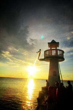 Negril, Negril, Jamaica - Young boys do remarkable dives off this lookout to earn money. One young man told us he was saving his money to buy clothes and help his mom to provide Christmas.