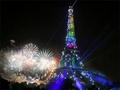 The Eiffel Tower fireworks illuminate Paris.