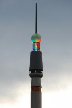 Stefan Skyneedle | Brisbane , Queensland Australia.   The colourful new LED lighting on the Stefan Skyneedle contrasts against a grey twilight sky. by stephenk1977