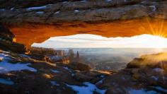 Sunrise Canyonlands The sun peeks through Mesa Arch in Canyonlands National Park, Utah (© Zev Yanovich)