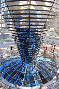 
                        
                            Norman Foster, "Reichstag Dome", 1999, a glass dome constructed on top of the rebuilt Reichstag building, symbolizing the reunification of Germany.  A mirrored cone in the center of the dome directs sunlight into the building, so that visitors can see the working of the chamber, Berlin, Germany.
                        
                    