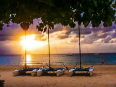 Negril, Negril, Jamaica - Hobie cats resting on 7-Mile Beach at sunset