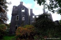 
                        
                            Kenmure Castle is a country house in Dumfries and Galloway, south-west Scotland. The site was occupied from the Middle Ages, and the house incorporates part of a 17th-century castle. This was remodelled in the 19th century, but the house has been derelict since the mid-20th century. It was the seat of the Gordon family of Lochinvar, later raised to the peerage as Viscounts of Kenmure. The castle is located in The Glenkens, 1 mile (1.6 km) south of the town of New Galloway
                        
                    