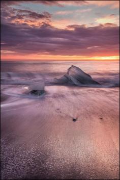 
                        
                            Breiðamerkurjökull, Iceland - It just takes a day long trip from Reykjavik you will find one of the most well-known natural wonders of Iceland. The glacier lagoon Jökulsárlón. I have spent lots of time there, watching the floating icebergs on the water. Enjoying the reflection of the glacier in the water. An equally beautiful but less known attraction can be found a stone’s throw away: the black beaches of the South coast, right next to the lagoon, called Breiðamerkursandur. Through a short river, the Jökulsá á Breiðamerkursandi, regularly chunks of ice are floating into the open sea and get, according to the high or low tide, washed onto this beautiful beach. More on stuckiniceland.co...
                        
                    