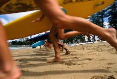 
                        
                            Annie Griffiths photo:  Surfers running into the surf on Bondi Beach, Sydney N.S.W. Australia.
                        
                    