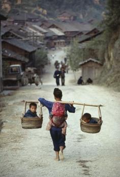 
                        
                            Two in the side cars and one on the back at Guizhou, China
                        
                    