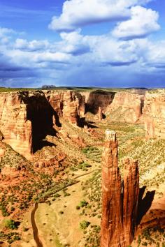 
                    
                        On the early spring day when I headed for Canyon de Chelly, a cloudless cerulean sky greeted me. Stolid cacti had taken on an air of revelry, sporting brilliant blossoms of pink, yellow, and red. The air was cool, but my skin soaked up the warm sun.
                    
                