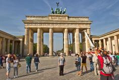 Standing in front of the Brandenburg Gate, which sat in the no-man's land between the two sides of the Berlin Wall during the Cold War