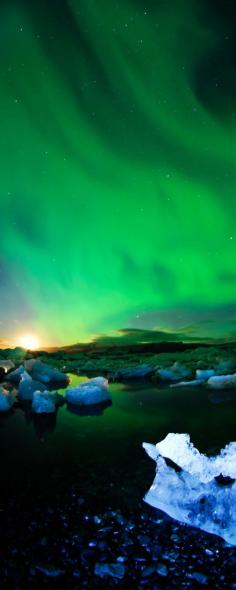 
                    
                        15 reasons why Norway will Rock your World | 7. Incredible strong northern lights during moon setting behind glaciers, Norway
                    
                