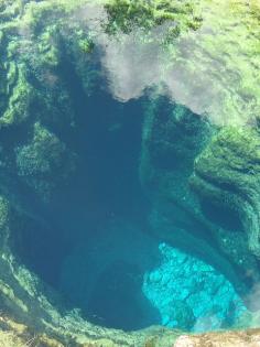 
                    
                        Jacob's Well in Wimberley, Texas. It's a significant karstic spring, the largest perennial spring in the Texas Hill Country. It flows from the most extensive underwater cave in Texas. 4m diameter mouth cave, descends vertically for about 10m, continuing from there at an angle as a series of chambers separated by narrow, often deeply silted and unstable necks, ultimately reaching a depth of at least 40m.
                    
                