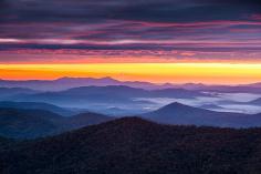 
                    
                        Blue Ridge Twilight - Blue Ridge Parkway Sunrise over the morning fog along the Blue Ridge Parkway in Western North Carolina on a cool morning in October.
                    
                