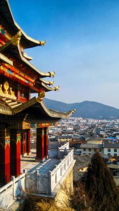 
                    
                        A raised Tibetan temple, looking out over the small township of Shangri-La.
                    
                