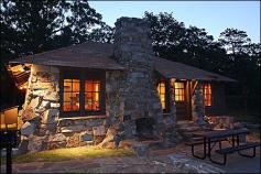 
                    
                        Cabin at Mount Nebo State Park, Dardanelle, Arkansas. Mount Nebo State Park is a gorgeous park with incredible scenic views. It also features 14 comfortable cabins with fully-equipped kitchens and fireplaces. Bring your own bike or rent one from the park visitor center.
                    
                