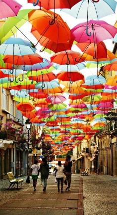 
                    
                        Hundreds of Floating Umbrellas Above a Street in Agueda, Portugal
                    
                