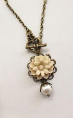 
                    
                        Nature Woodlands Vintage Style Pretty Marigold in almond, heart toggle clasp and Swarovski Pearl Necklace
                    
                