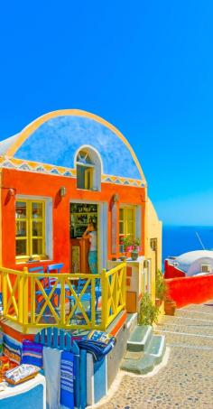 
                    
                        Typical colorful narrow street in Oia the most beautiful village of Santorini island in Greece    |    10 Breathtaking Photos of World's Most Romantic Island
                    
                