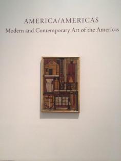 
                    
                        Title of the room that the Marina Metafisica by Julio Alpuy is located. The piece below demonstrates how well the room shows both compliance and diversity. This piece is fairly close to Apluy's piece and both pieces and surrounding pieces are also mostly Latin American. The earthly tones and materials really relate to each other and bring a feeling of unison even though AMERICA/AMERICAS: Modern and Contemporary Art of the Americas' room.
                    
                