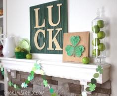 
                    
                        St Patricks Mantel featuring a gold and green "LUCK" sign, shamrock string art, paint chip garland and lots of green accessories.
                    
                