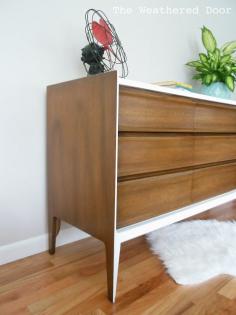 
                    
                        A walnut and white mid century dresser
                    
                