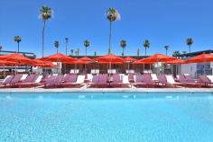 
                    
                        Swimming pool with red lounge furniture
                    
                