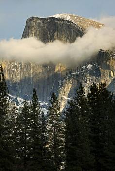 
                    
                        Half Dome with a crown of clouds
                    
                