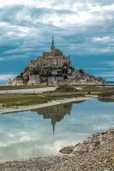 
                    
                        Straddling Brittany's border with Normandy is the spectacular Abbey of Mont-Saint-Michel, which rises like a dream from the coastal flats of the Atlantic. It must be seen to be believed. Located about 175 mi/282 km west of Paris (close to Normandy), the Abbey was built in the 10th century. The cathedral-citadel sits atop a 260-ft granite promontory. At high tide, the place becomes an island; at low tide, a sandy causeway links it to the mainland (be aware that the tide comes in very quickly).
                    
                