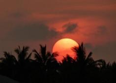 
                    
                        The sun sinks behind Sunset Key in Key West, Florida
                    
                