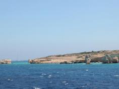 
                    
                        Breathtaking bright blue coves surrounding the rocky inlets of Kato Koufonissi.
                    
                