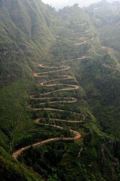 
                    
                        Long and winding road to Hana.  A hair raising drive with beautiful awe inspiring views.  The road is long but the rewards of walking on a black sand beach and seeing the Seven Sacred Pools is worth the drive.
                    
                