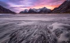 
                    
                        The rugged Lofoten islands in Arctic Norway. Water and wind have formed some amazing patterns in the sand on this beach at sunrise. (From: 12 GORGEOUS Images of the 'Golden Hour' Around the World)
                    
                