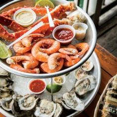 
                    
                        America's Best Seafood Dives: Half Shell Raw Bar, Key West, Florida. Don't try to count all of the license plates that cover the walls of this sprawling former shrimp warehouse on the dock. Just tuck back into some briny and broad-shelled Gulf Coast oysters; mammoth, buttery-sweet peel-and-eat shrimp; and devilishly addictive fish dip, made from house-smoked local catch. Coastalliving.com
                    
                