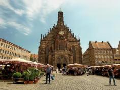 
                    
                        Hauptmarkt and Church of Our Lady, in the city center of Nuremberg, Germany. The market is best known for its gingerbread cookies.
                    
                