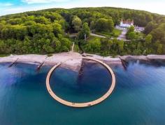 
                    
                        gjøde & povlsgaard arkitekter elevates the infinite bridge over danish coast seaside.
                    
                