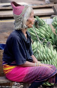 
                        
                            Western China | Wa woman at the market. Yunnan | ©Nick Mayo
                        
                    