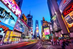 Times Square crowds and traffic at night in New York City