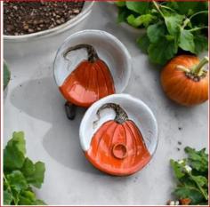 The Matte White Pumpkin Bowl, approximately 10.5 inches in diameter, is a charming and versatile addition to any kitchen or dining space. Crafted in a subtle matte white finish, this bowl brings an elegant touch of seasonal style, ideal for fall gatherings or year-round decor. Shaped like a classic pumpkin, it combines rustic charm with a modern finish, making it perfect for serving salads, fruits, or festive treats. Its durable construction ensures long-lasting use, while the unique design adds a cozy, farmhouse-inspired accent. The Pumpkin Bowl effortlessly blends style and functionality, enhancing any table setting with understated sophistication.